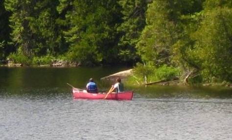 Two people on the lake in a canoe
