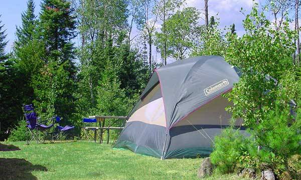 Tent and picnic bench at campgrounds.